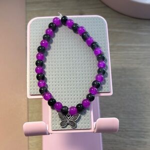 Purple and Black Beaded Bracelet with Butterfly Charm handcrafted by me